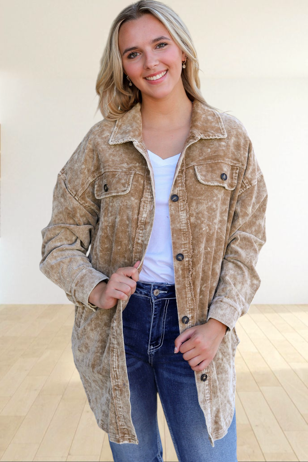 Baya Wear khaki mineral wash corduroy shacket with button-down front and chest pockets worn by a smiling woman