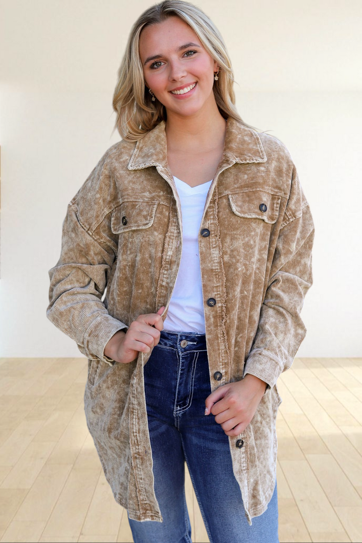 Baya Wear khaki mineral wash corduroy shacket with button-down front and chest pockets worn by a smiling woman