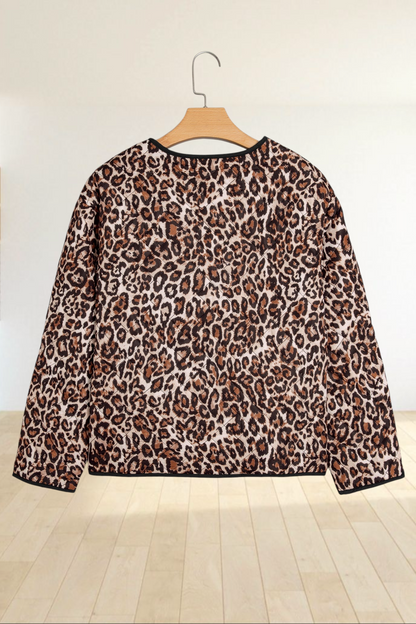 Baya Wear brown leopard print quilted jacket with black trim, shown from the back on a wooden hanger.