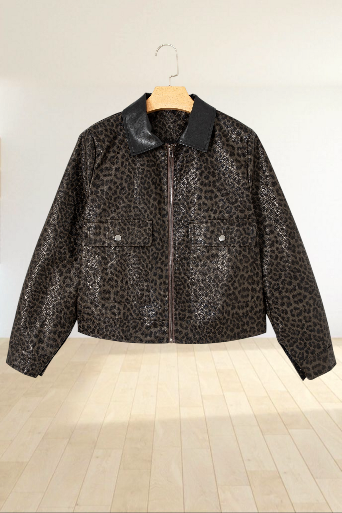 Baya Wear cropped leopard print jacket with a black collar, front zip closure, and snap-button pockets.
