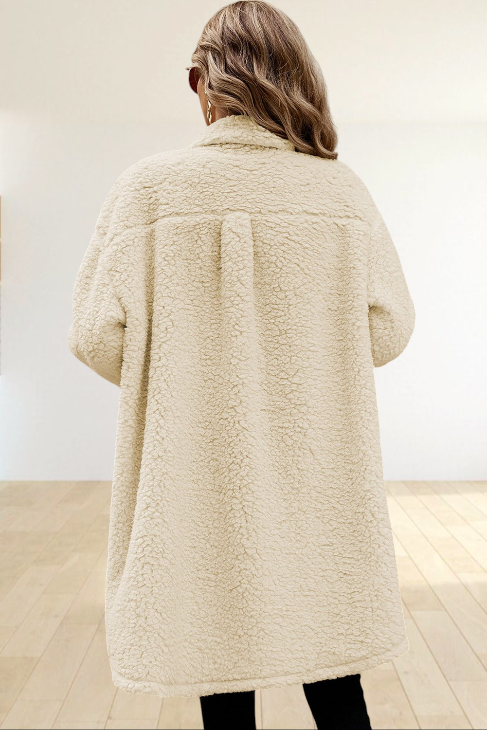 Back view of a woman wearing a Baya Wear longline cream teddy fleece shacket with a cozy textured finish