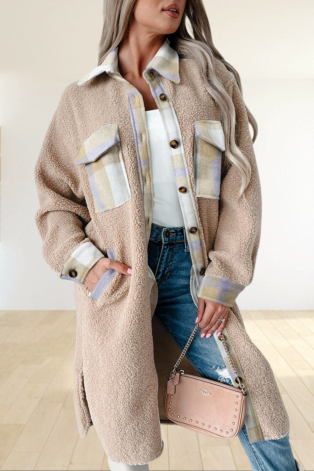 Baya Wear longline teddy fleece shacket in beige with plaid patchwork details, button-up front, and chest pockets.