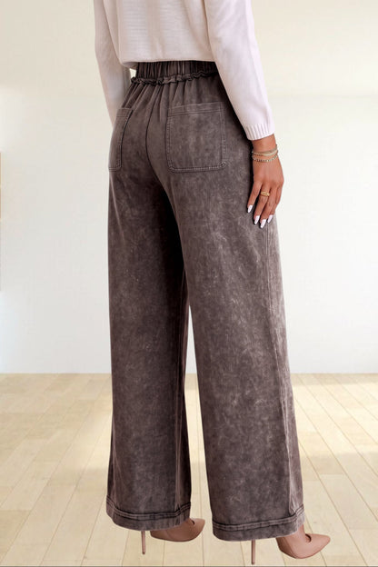 Baya Wear mineral wash flare leg lounge pants with drawstring waist and back pockets worn with a white sweater