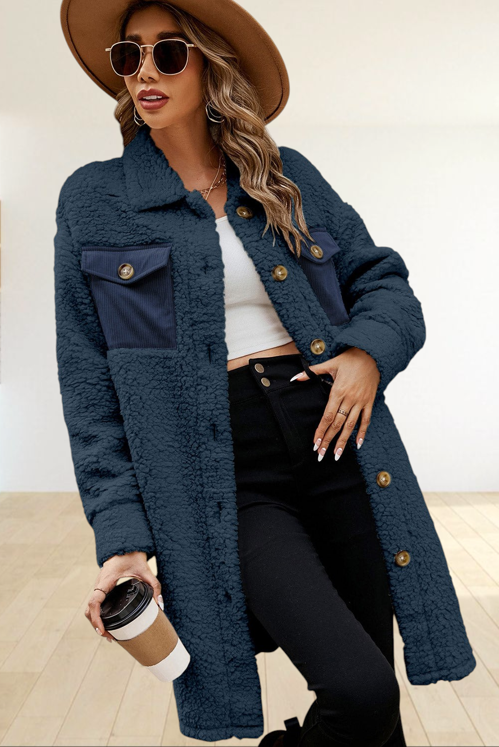 Baya Wear navy blue longline teddy fleece shacket with contrast corduroy chest pockets worn by a model in a hat