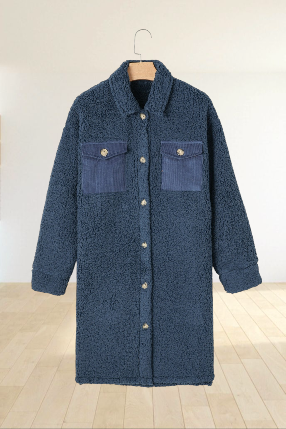 Baya Wear longline navy blue teddy fleece shacket with contrast corduroy chest pockets and button-front closure.