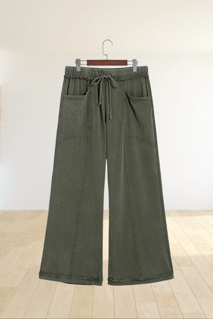 Baya Wear olive green mineral wash wide leg lounge pants with drawstring waist, seam details, and front pockets.