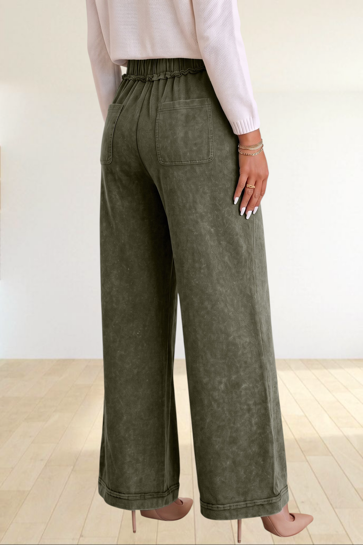 Baya Wear olive green mineral wash flare leg lounge pants with a drawstring waist and back pockets, back view.