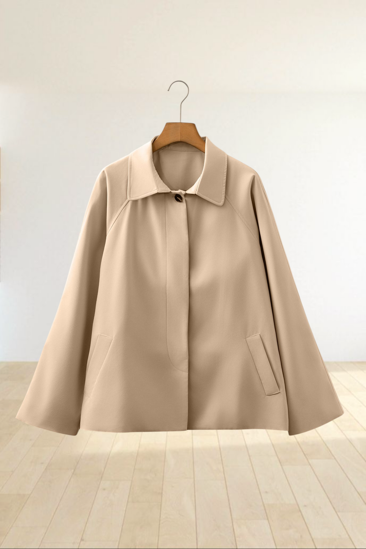 Baya Wear parchment beige cropped single-breasted trench jacket with a structured collar and side pockets.