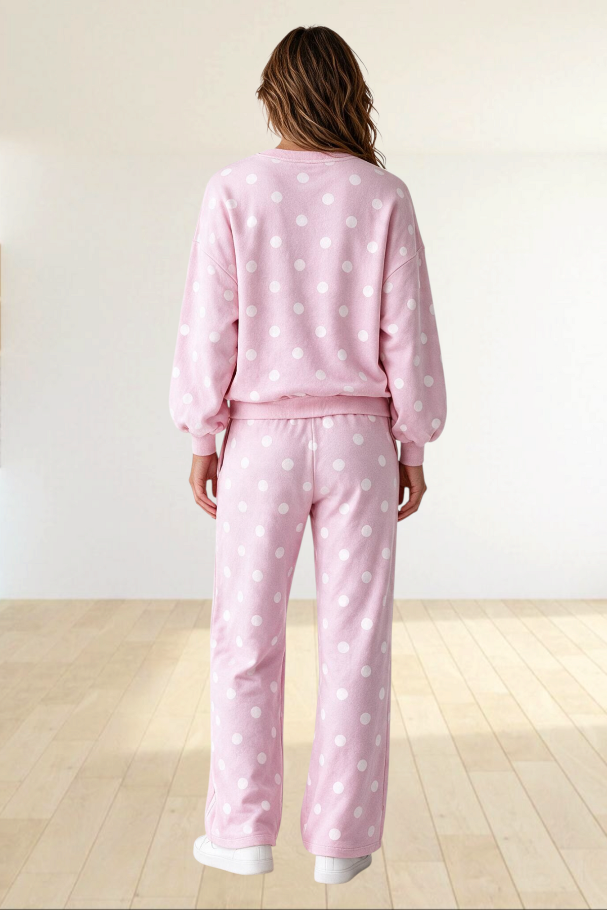 Baya Wear pink polka dot lounge set with crewneck sweatshirt, balloon sleeves, and wide leg pants, back view.