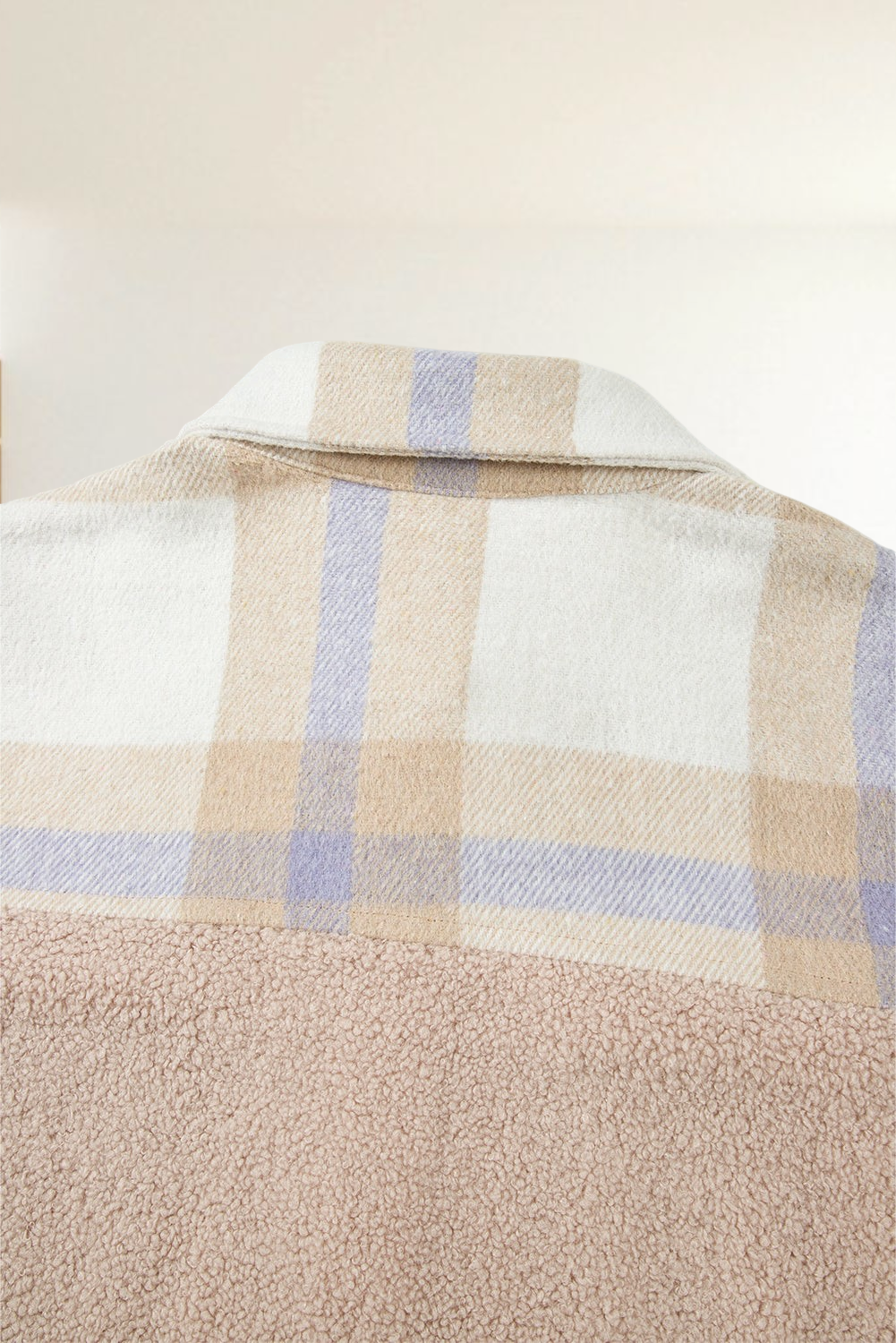 Baya Wear longline shacket featuring a beige and lavender plaid collar and upper panel with soft textured sherpa base