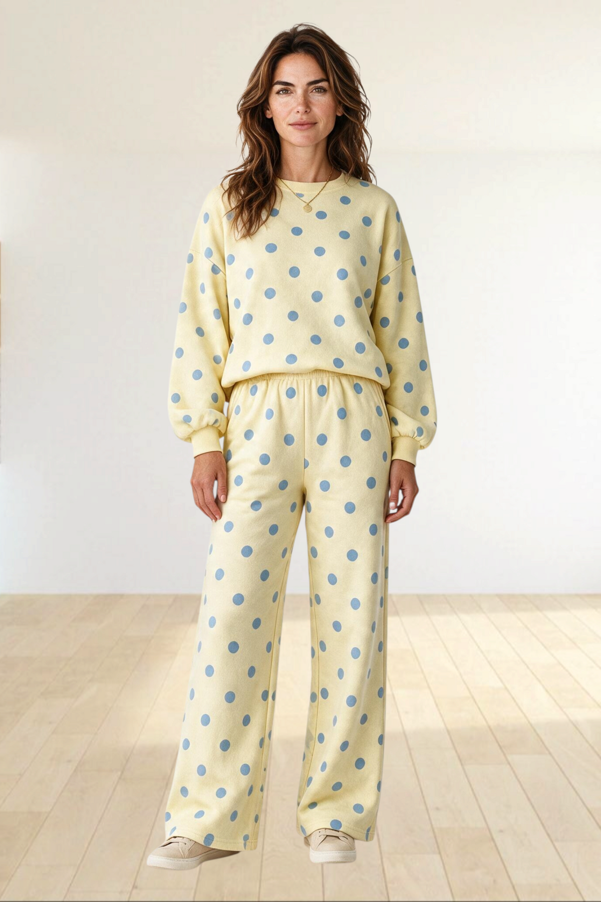 Baya Wear yellow and blue polka dot lounge set with crewneck balloon sleeve sweatshirt and wide leg pants.