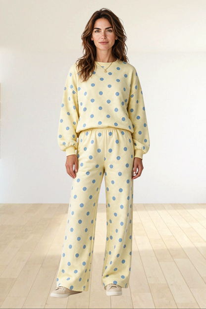 Baya Wear yellow and blue polka dot lounge set with crewneck balloon sleeve sweatshirt and wide leg pants.