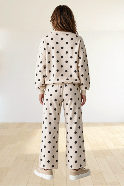 Baya Wear beige polka dot lounge set with a crewneck balloon sleeve sweatshirt and wide leg pants, back view.