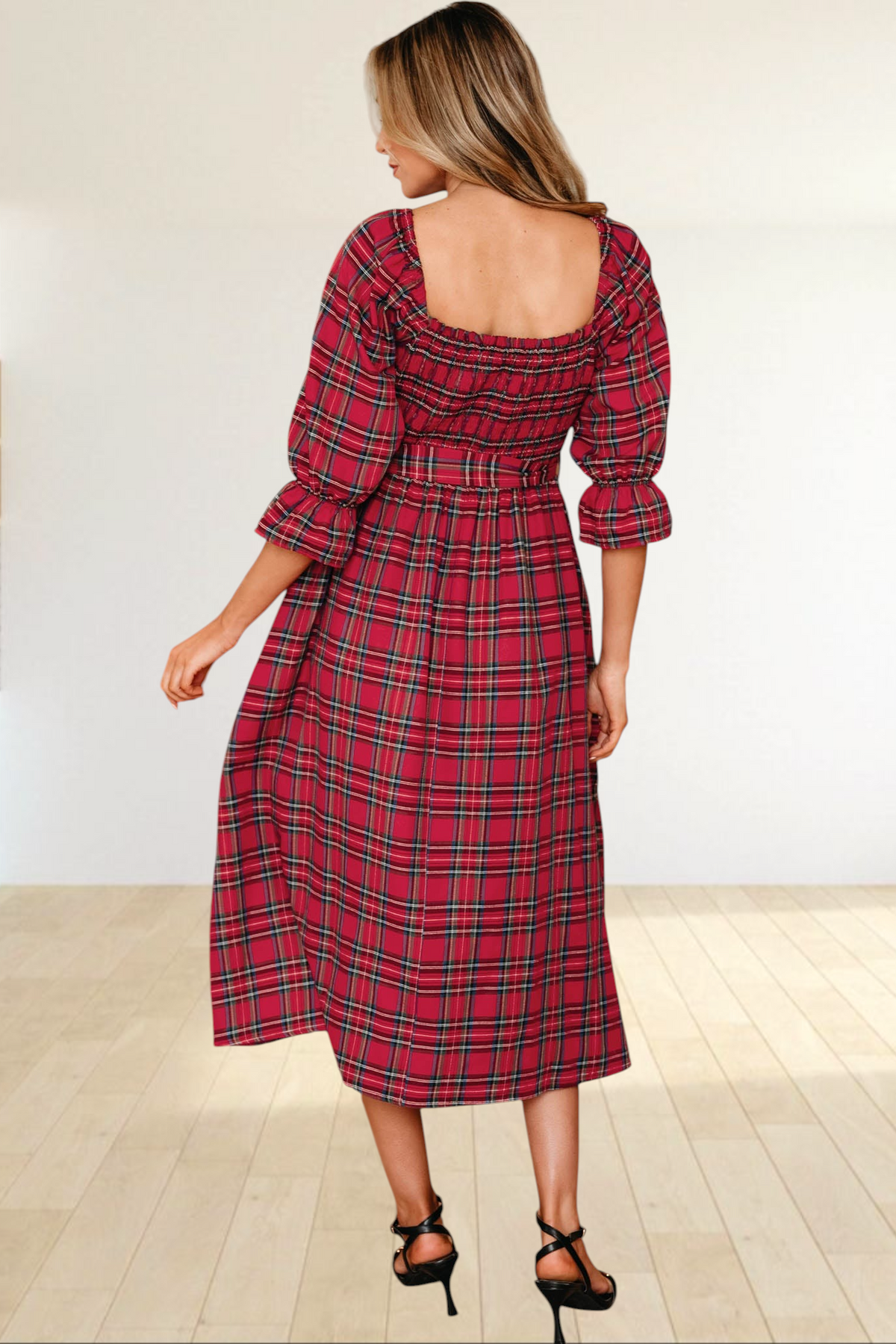Baya Wear red tartan plaid midi dress with smocked bodice, puff sleeves, and ruffled cuffs, back view.