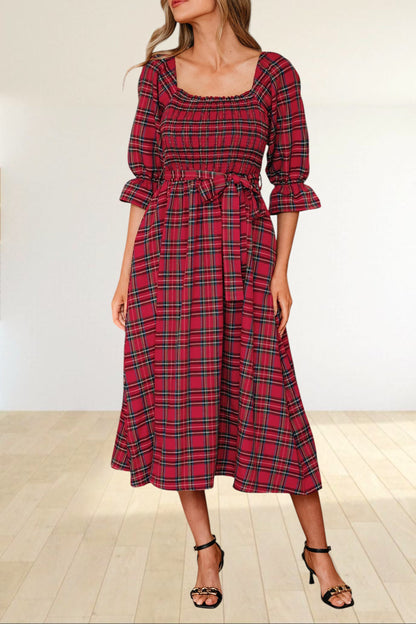 Baya Wear red tartan plaid midi dress with a smocked bodice, square neckline, puff sleeves, and a waist tie.