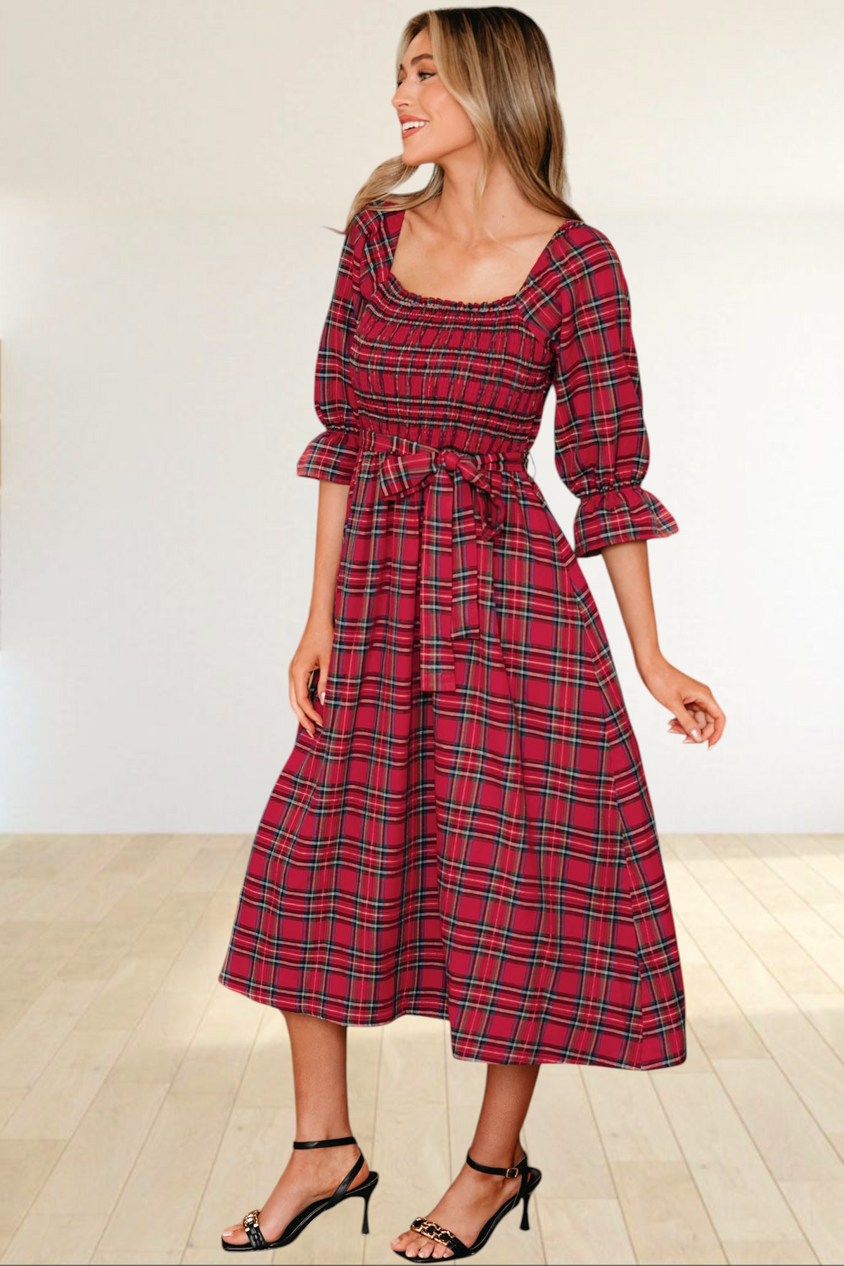 Baya Wear red tartan plaid midi dress with smocked bodice, square neckline, puff sleeves, and waist tie in a kitchen.