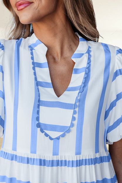 Baya Wear tiered midi dress in white and blue stripes featuring a notched neckline with blue scalloped ricrac trim.