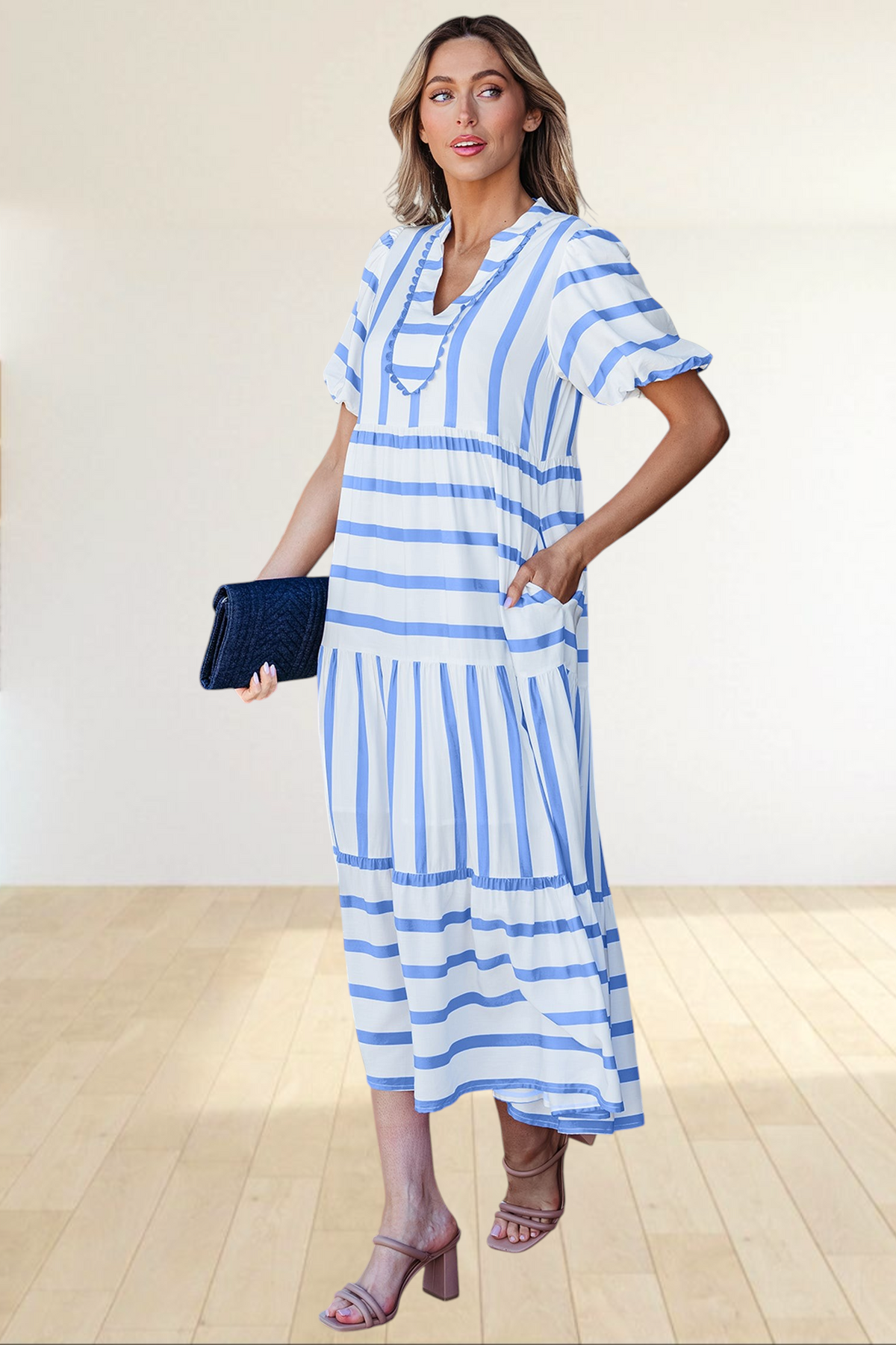 Baya Wear tiered midi dress in white and blue stripes with a notched neckline, ricrac trim, and side pockets.