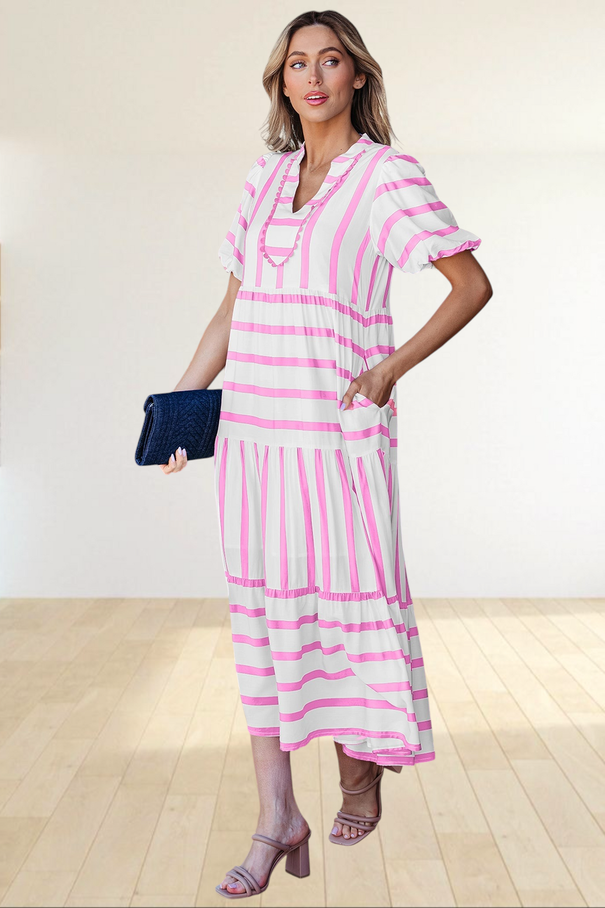 Baya Wear tiered midi dress in white with pink stripes, featuring a notched neckline, ricrac trim, and side pockets.
