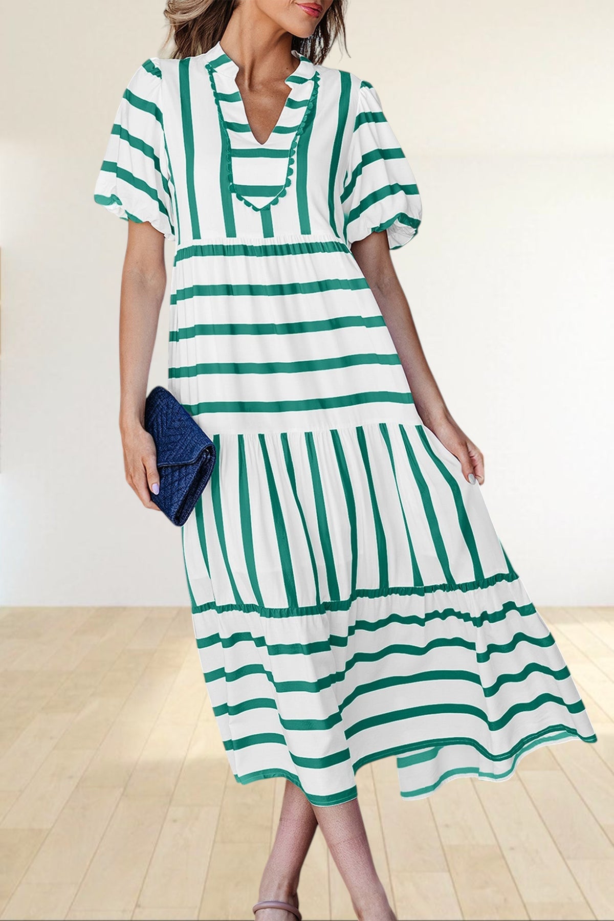 Baya Wear tiered midi dress in white with green stripes, featuring a notched neckline, ricrac trim, and half sleeves.