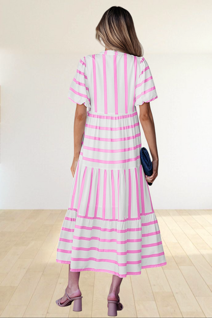 Baya Wear tiered midi dress in white with pink vertical stripes, featuring half sleeves and a relaxed silhouette.