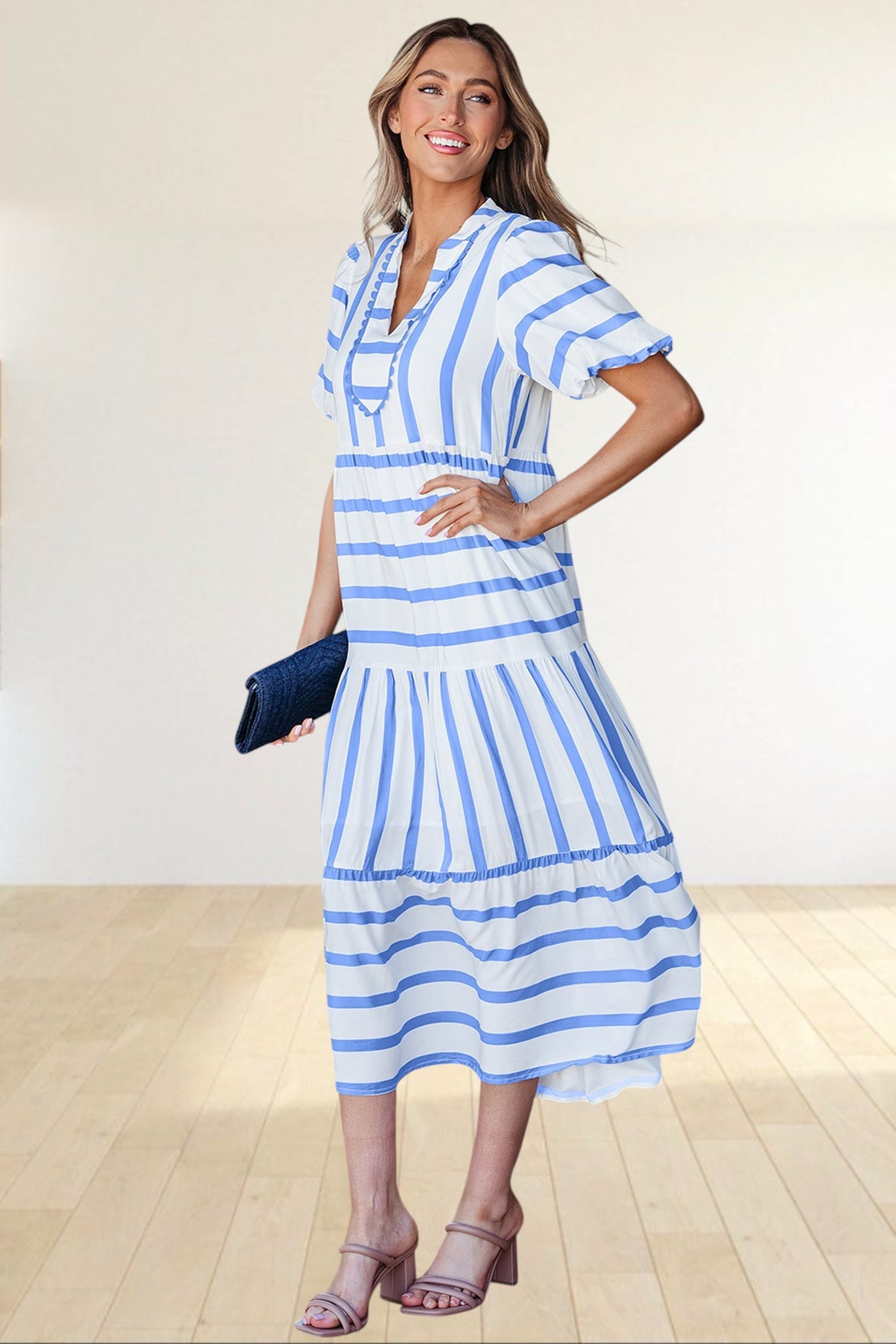 Baya Wear tiered midi dress in white and blue stripes with a notched neckline, ricrac trim, and half-length sleeves.