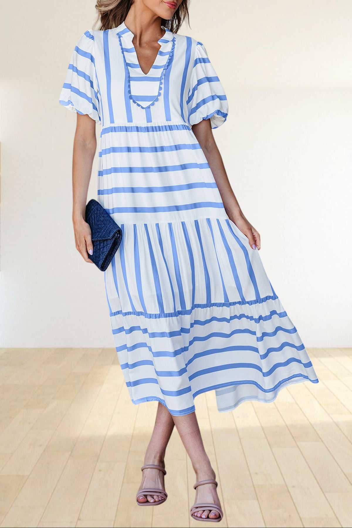 Baya Wear tiered midi dress in white with blue stripes, featuring a notched neckline, ricrac trim, and side pockets.