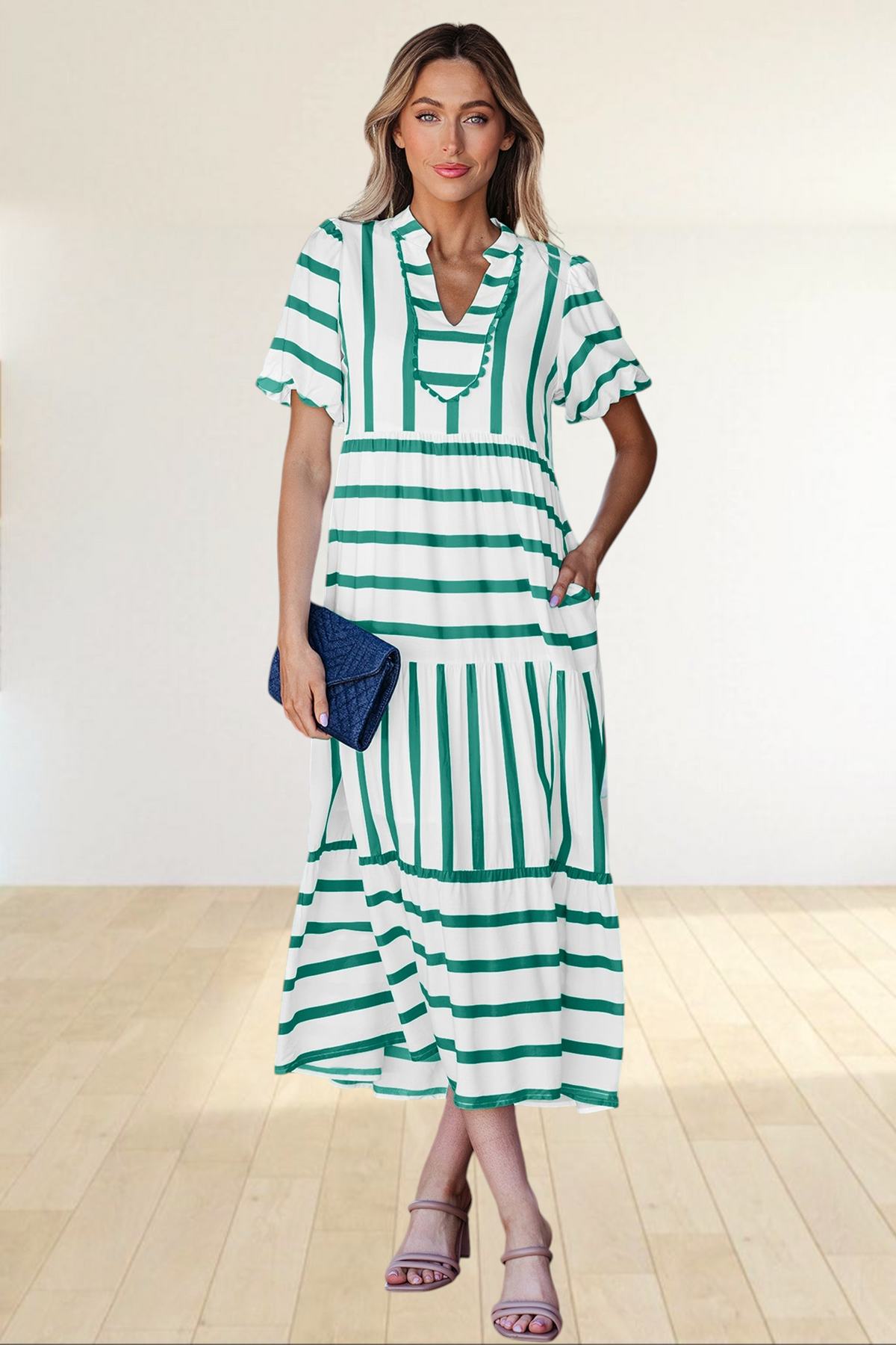 Baya Wear tiered midi dress in white and green stripes with a notched neckline, ricrac trim, and side pockets.