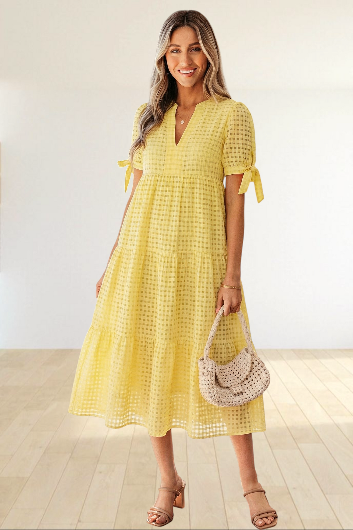 Baya Wear yellow textured gingham tiered midi dress with V-neck, short sleeves with bow ties, and side pockets.