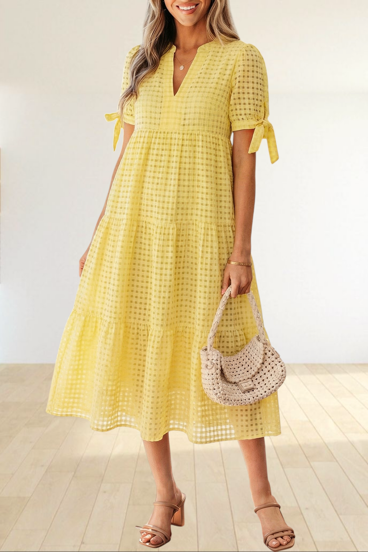 Baya Wear yellow textured gingham tiered midi dress with V-neck, short sleeves, and bow-tie details on a model
