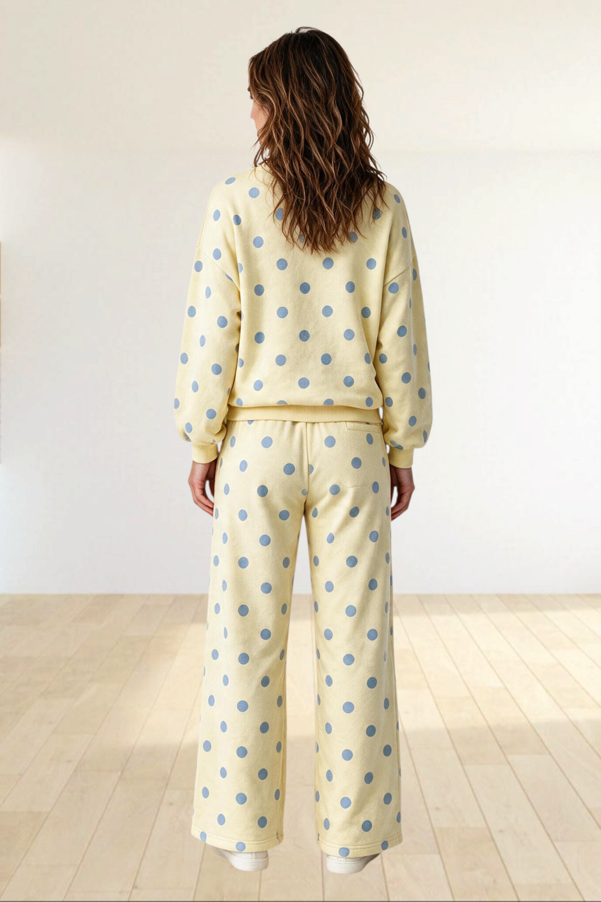Baya Wear yellow polka dot lounge set with crewneck balloon sleeve sweatshirt and wide leg pants, back view